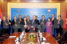 Organizaciones de masas de Vietnam y Laos robustecen cooperación