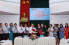 VNA y Unión de Mujeres de Vietnam firman acuerdo de cooperación  