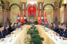 Presidente de Vietnam recibe a secretario general de PPRL y presidente de Laos