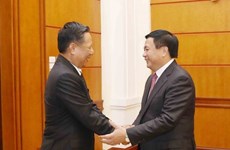 Fomentan Vietnam y Laos cooperación bilateral en ciencias sociales 