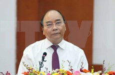 Premier de Vietnam insta al sector financiero a apoyar la restauración económica