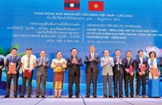 Hanoi y Vientiane promueven cooperación en inversión, comercio y turismo