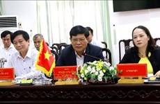 Localidades de Vietnam y Laos intercambian experiencias en trabajo del Frente 