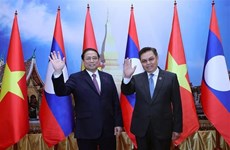 Vietnam y Laos atesoran a consolidar la gran amistad y cooperación integral bilateral