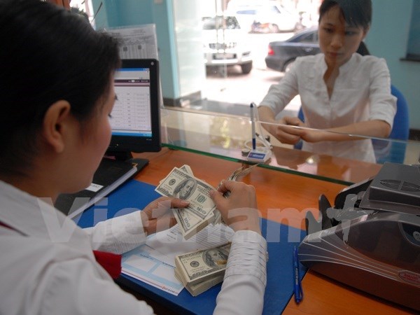 Banco Estatal reajusta uno por ciento tipo de cambio interbancario hinh anh 1