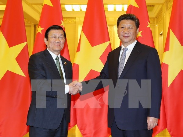 En Beijing se reunen Truong Tan Sang y Xi Jinping hinh anh 1