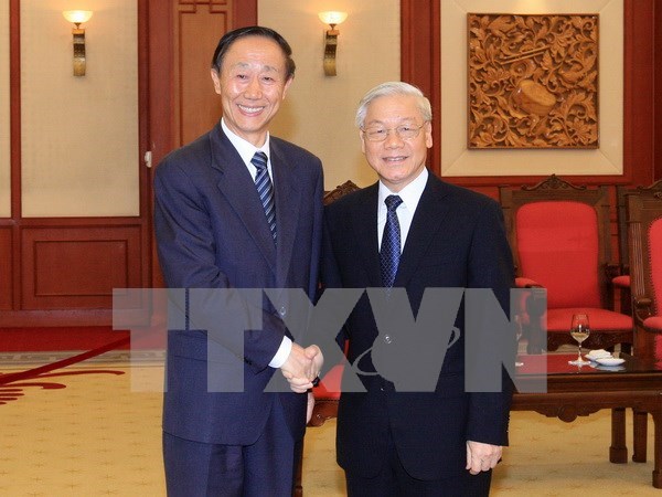 Recibe maximo lider partidista de Vietnam a dirigente chino hinh anh 1