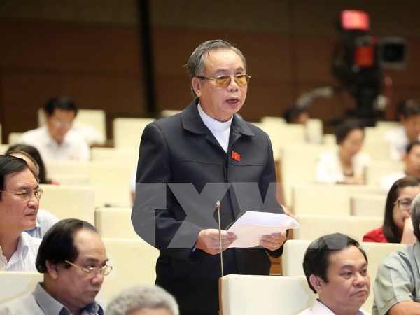 Parlamento vietnamita continua debates para perfeccionar las leyes hinh anh 1