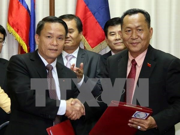 Agencias vietnamitas y laosianas de noticias fortalecen cooperacion hinh anh 1