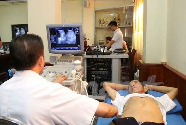 Vietnam ayuda a Laos a desarrollar sistema telemedico hinh anh 1