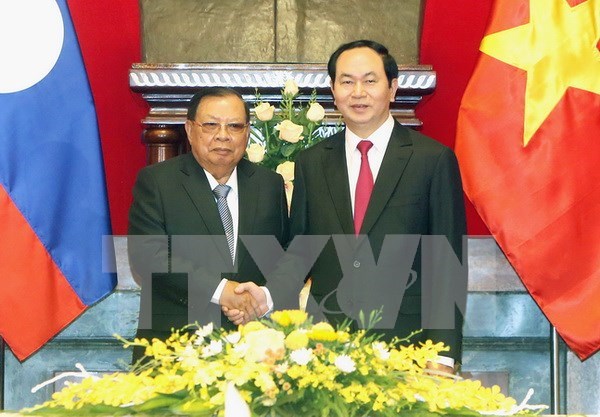Visita del presidente laosiano a Vietnam profundiza nexos especiales bilaterales hinh anh 1