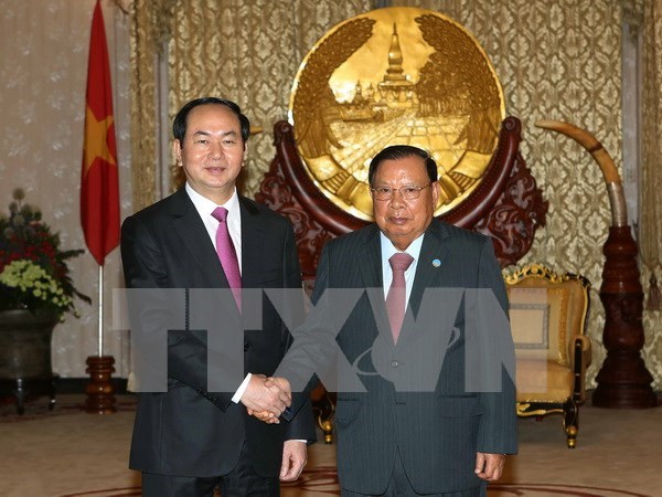 Visita a Laos del presidente de Vietnam capta especial atencion de prensa hinh anh 1