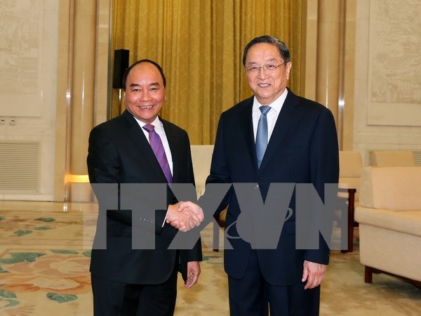 Premier de Vietnam apoya cooperacion con organizaciones de masas de China hinh anh 1
