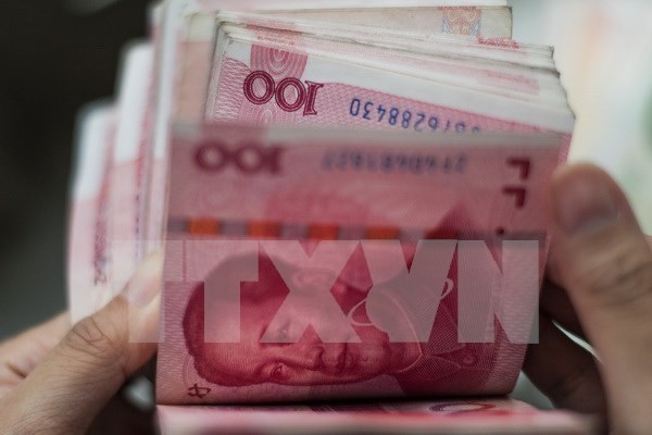 Ingreso de yuan chino a cesta de monedas de FMI no afecta inmediatamente a Vietnam hinh anh 1