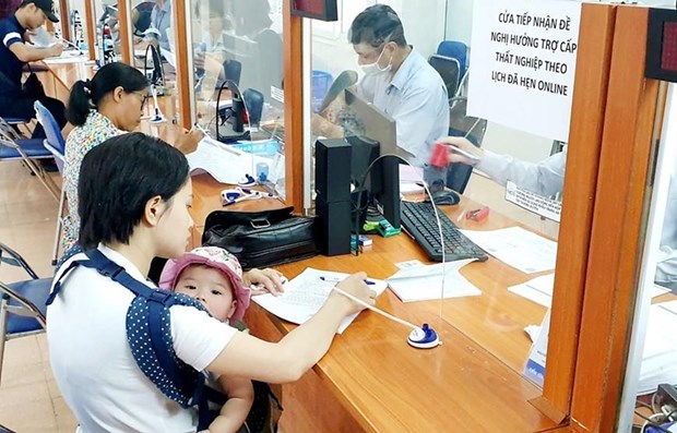 Vietnam mantiene respaldo a los trabajadores afectados por el COVID-19 hinh anh 1