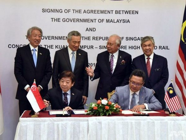 Malasia y Singapur firman acuerdo de ferrocarril de alta velocidad hinh anh 1