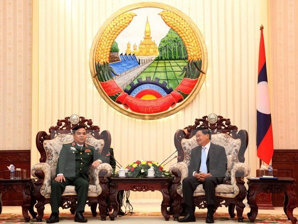 Premier de Laos resalta labor de busqueda de restos de soldados vietnamitas caidos en su pais hinh anh 1