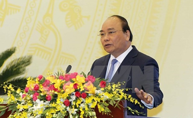 Premier vietnamita urge mayores esfuerzos por garantizar estabilidad financiera hinh anh 1