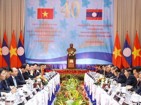 Premieres de Vietnam y Laos copresiden reunion 40 del Comite Intergubernamental hinh anh 1