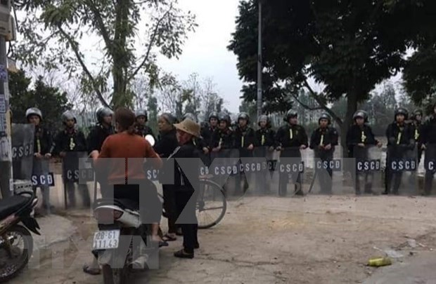 Procesa policia de Hanoi caso de disturbio en comuna suburbana de Dong Tam hinh anh 1