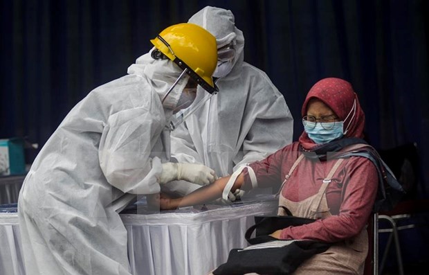 Indonesia amplia restricciones sociales en medio de pandemia hinh anh 1