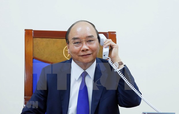 Primer ministro de Vietnam conversa con presidente de Estados Unidos hinh anh 1