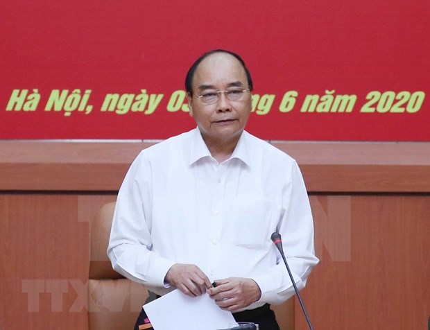 Pide premier de Vietnam impulsar cooperacion con Laos hinh anh 1