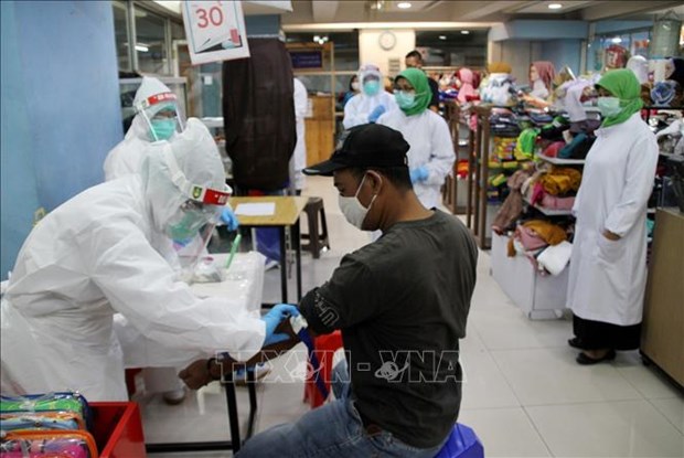 Indonesia registra mayor numero de casos nuevos de COVID-19 en un dia hinh anh 1
