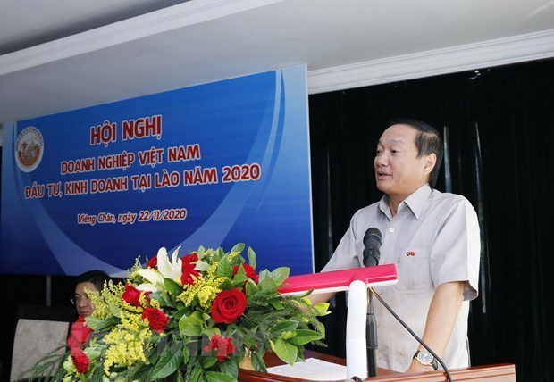 Empresas vietnamitas en Laos se esfuerzan por superar dificultades provocadas por COVID- 19 hinh anh 1