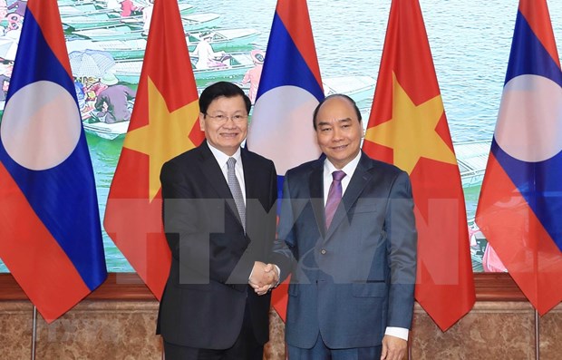 Premier de Laos visita Vietnam y copresidira reunion del Comite intergubernamental hinh anh 1