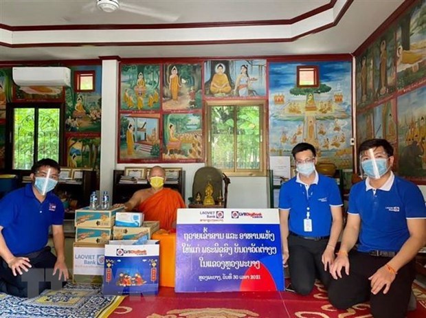 Comunidad vietnamita en Laos se une al gobierno local en prevencion y control del COVID-19 hinh anh 1