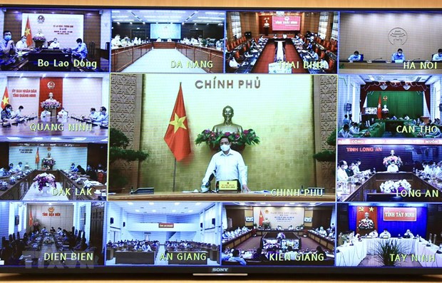 Primer ministro de Vietnam insta a garantizar la seguridad y salud de la poblacion ante COVID-19 hinh anh 1