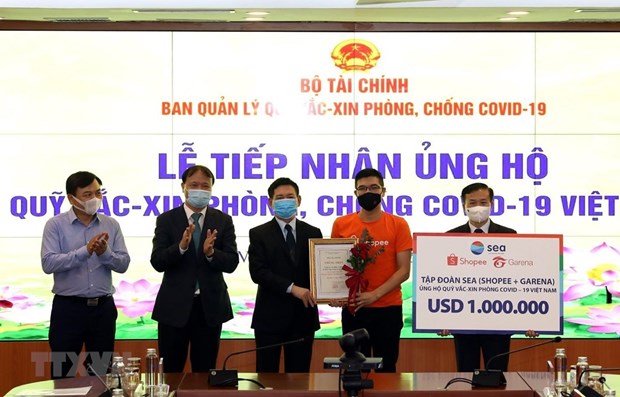 Recaudan 353 millones de dolares para fondo de vacunas contra el COVID-19 en Vietnam hinh anh 1