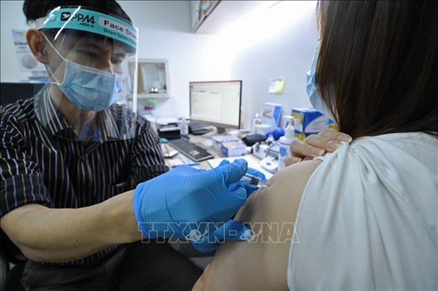 Singapur considera inyecciones de refuerzo contra el COVID-19 y vacunacion para menores de 12 anos hinh anh 1