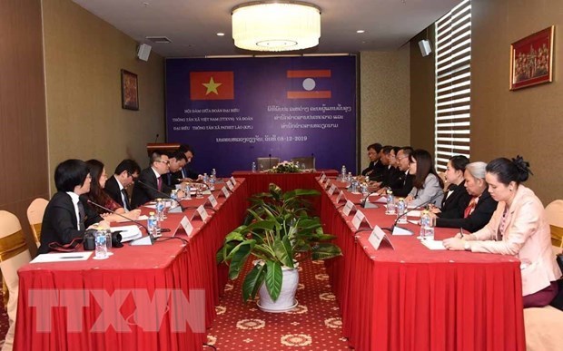 Resaltan cooperacion estrecha y duradera entre agencias noticiosas de Vietnam y Laos hinh anh 1