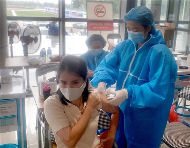 Vietnam registra 11 mil 521 casos nuevos del COVID-19 hinh anh 1
