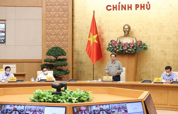 Primer ministro vietnamita urge controlar con flexibilidad y eficiencia el COVID-19 hinh anh 1
