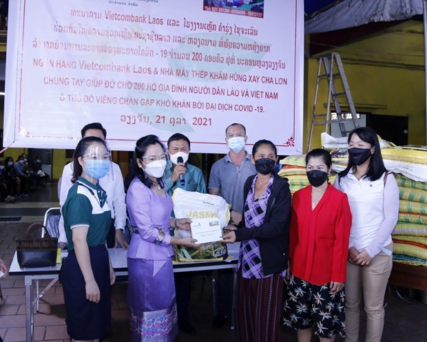 Comunidad vietnamita en Laos muestra solidaridad en medio del COVID-19 hinh anh 1