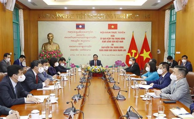 Fomentan cooperacion entre Comisiones partidistas de Control Disciplinario de Vietnam y Laos hinh anh 1