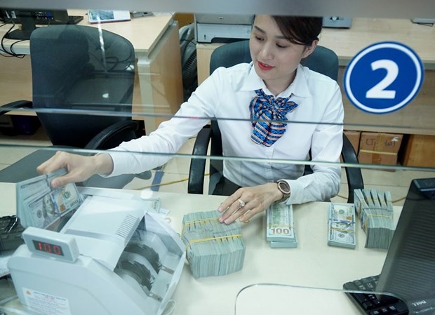 Bancos vietnamitas lanzan programas promocionales para atraer remesas por fin de ano hinh anh 1
