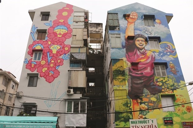 Murales coloridos embellecen antiguos edificios en Ciudad Ho Chi Minh hinh anh 1