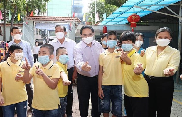Primer ministro pide a Ciudad Ho Chi Minh continuar campanas de vacunacion hinh anh 3