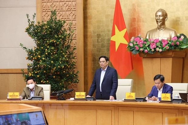 Premier de Vietnam insta a controlar el COVID-19 durante el feriado del Tet hinh anh 1