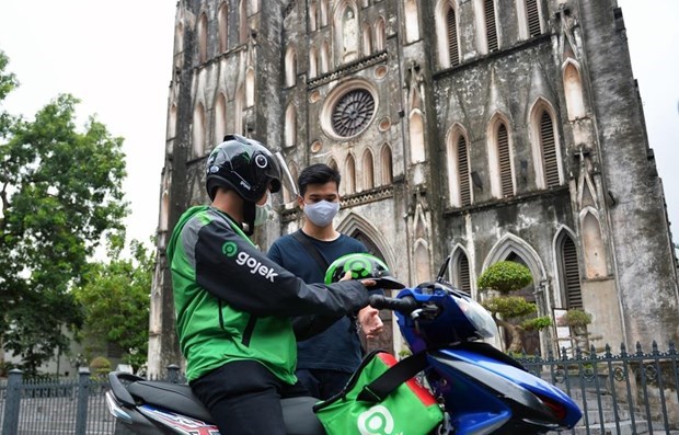 Hanoi permite reanudacion de servicios de taxi en moto hinh anh 1