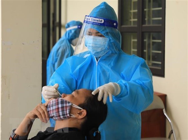 Vietnam registra 164 mil 596 nuevos casos del COVID-19 hinh anh 1