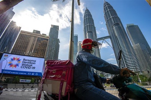 La reapertura de fronteras reactiva la economia de Malasia hinh anh 1
