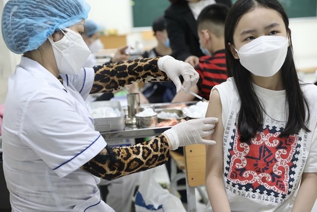 Hanoi avanza en la vacunacion antiCOVID-19 para ninos hinh anh 1