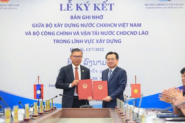 Vietnam y Laos firman acuerdo de cooperacion en sector de construccion hinh anh 2
