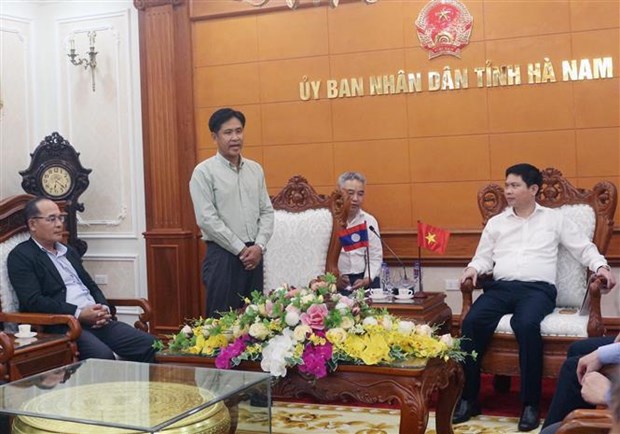Delegacion del Ministerio de Justicia de Laos realiza visita de trabajo en localidad vietnamita hinh anh 1