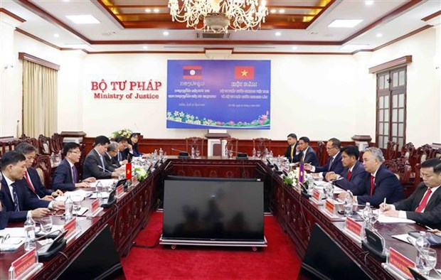 Ministerios de Justicia de Vietnam y Laos mejoran eficiencia de cooperacion hinh anh 1